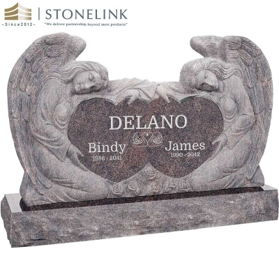 Kneeling angels embracing double heart granite headstone